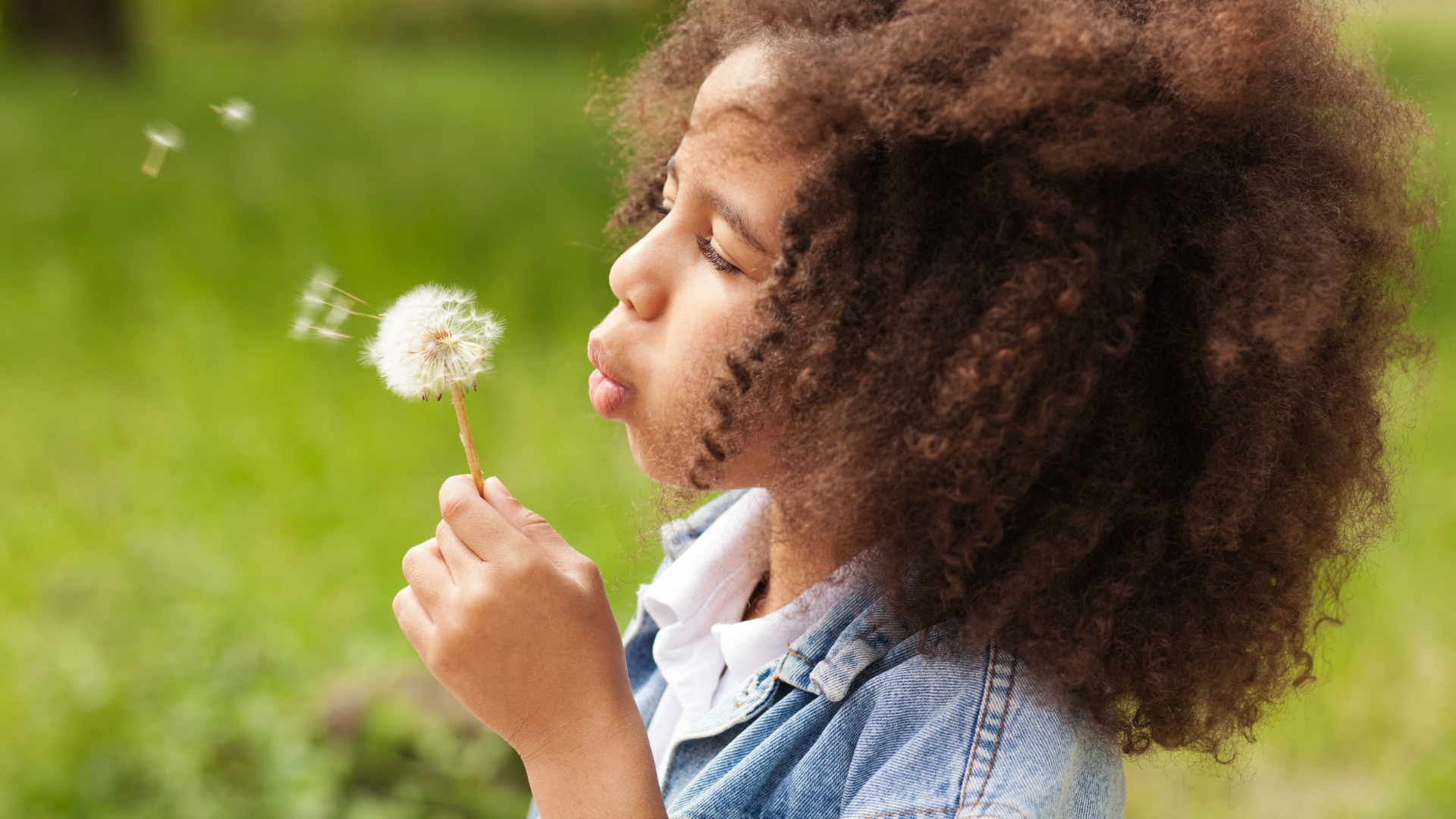 Girl Blowing Dandelion